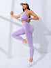 Damen Fitness Outfit in lila: Atmungsaktives Yoga-Set mit High-Waist Leggings und Sport-BH, ideal für Gym und Workout.